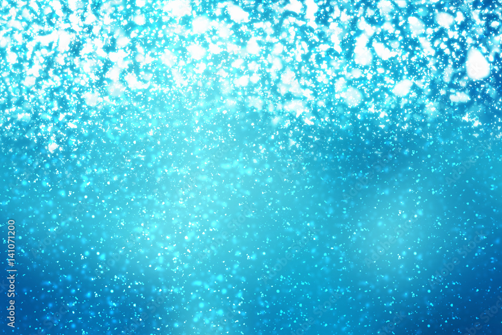 Fototapeta premium Abstract round silver bokeh or glitter lights on blue background. Circles defocused particles and rays