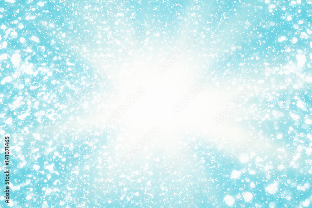 Abstract round silver bokeh or glitter lights on blue background. Circles defocused particles and rays Abstract round silver bokeh or glitter lights on blue background. Circles defocused particles and rays