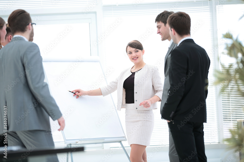 copywriter and designers stand next to a blank poster and discus copywriter and designers stand next to a blank poster and discus