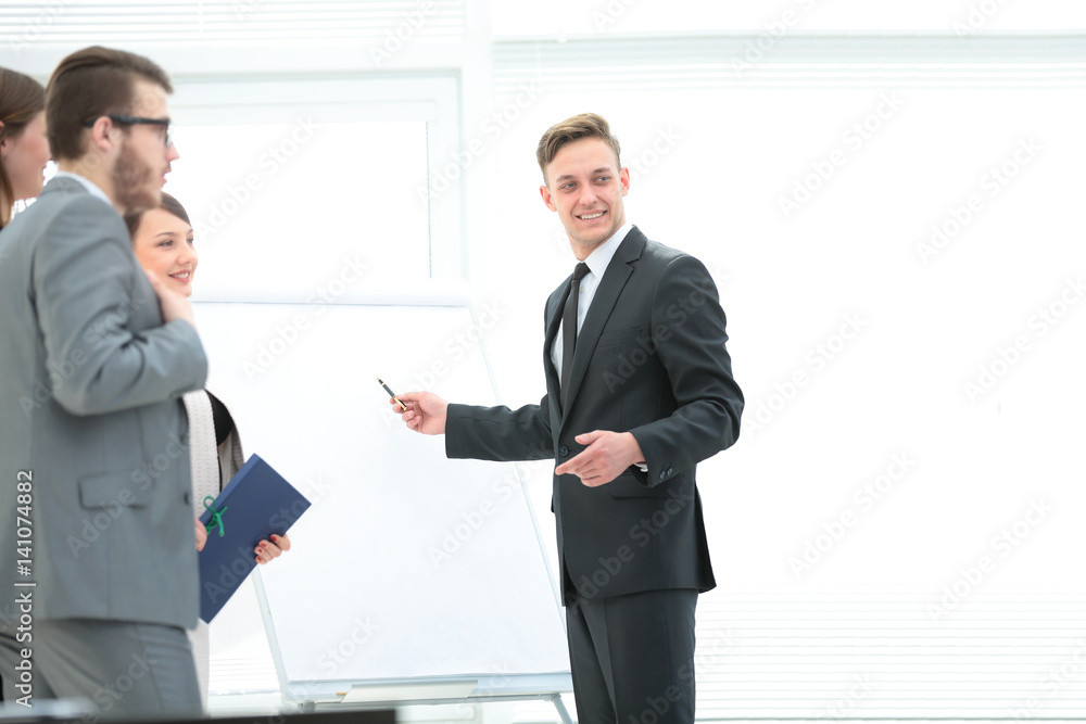 business team discussing a new business presentation near the bl business team discussing a new business presentation near the bl