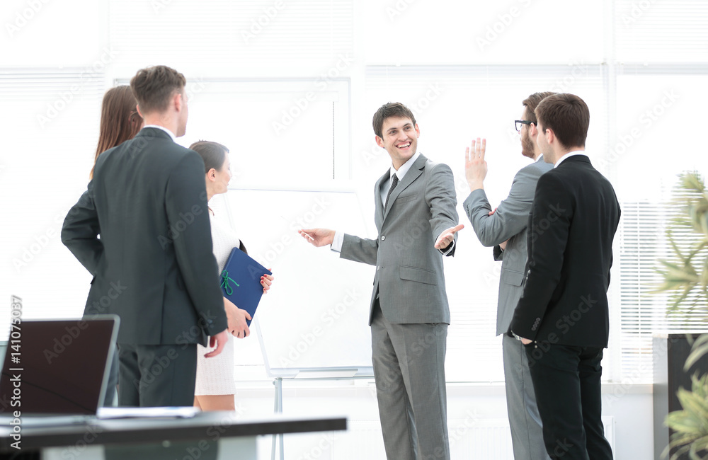 office life. business team discussing a new business plan next t