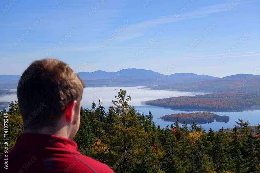 Fototapeta premium hiker gaze from the mountain top