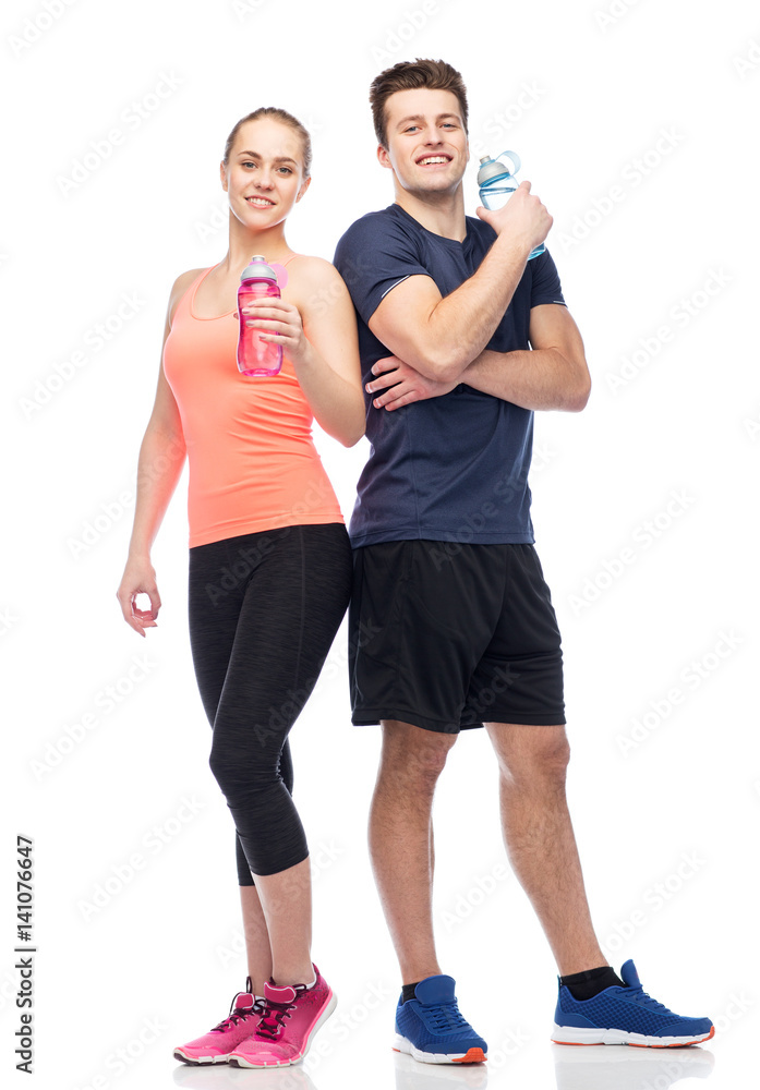 sportive man and woman with water bottles sportive man and woman with water bottles