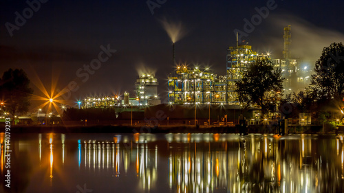 Industrial Chemical factory panorama with water reflection