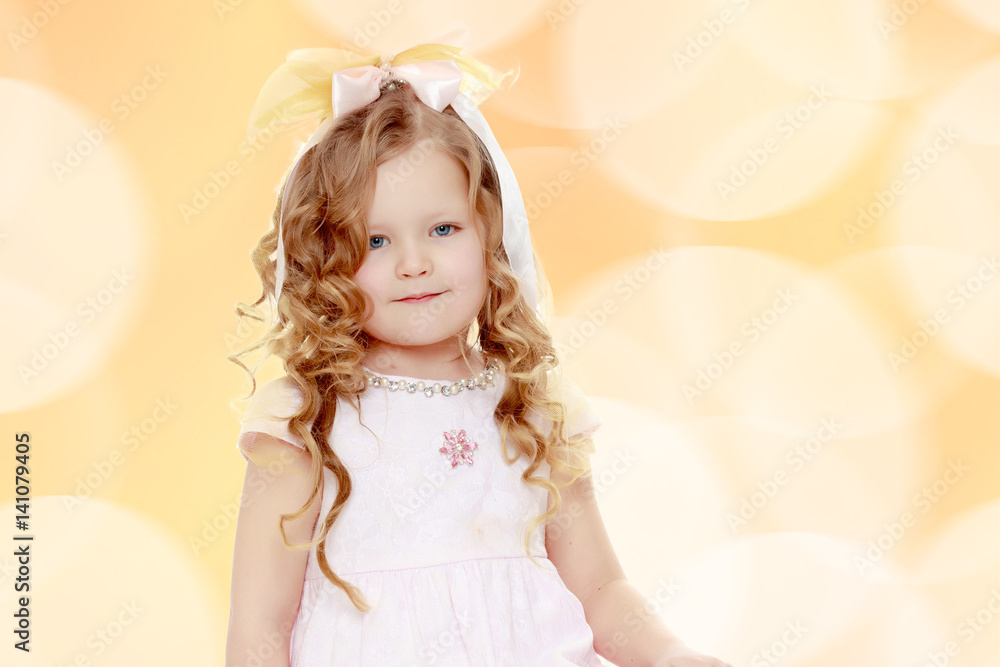 Fototapeta premium Little girl with curly hair.
