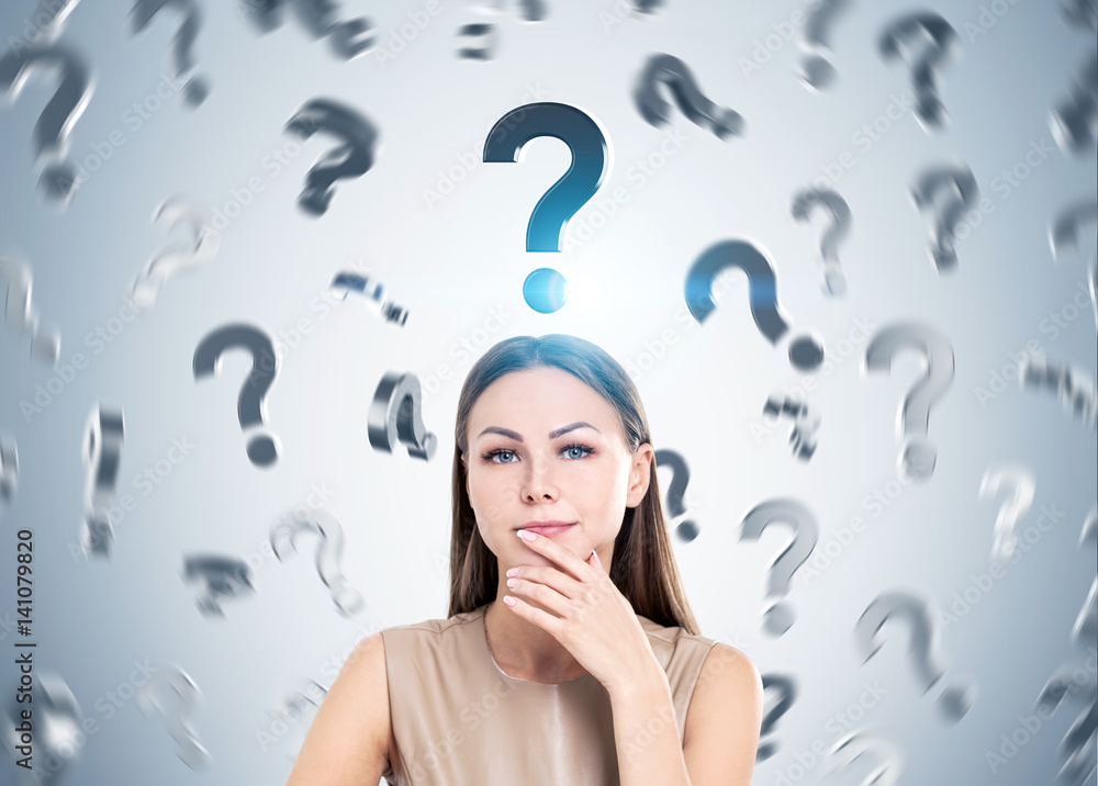 Pensive woman in beige and question marks