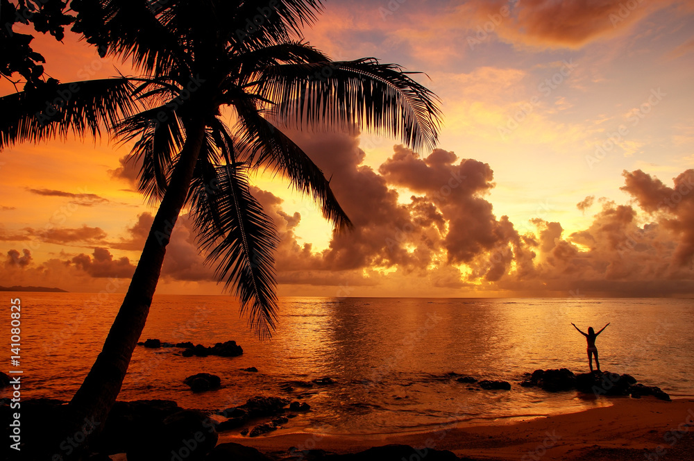 Fototapeta premium Colorful sunrise on the beach in Lavena village in Taveuni Island, Fiji