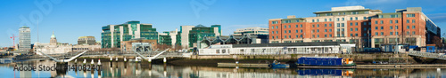 Dublin, Ireland, panoramic view over Liffey river with modern buildings © tilialucida