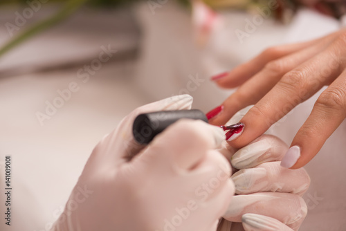 Woman hands receiving a manicure