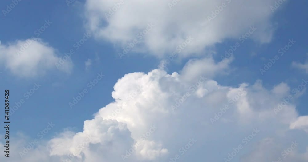 Time lapse shot of white fluffy clouds over blue sky Time lapse shot of white fluffy clouds over blue sky