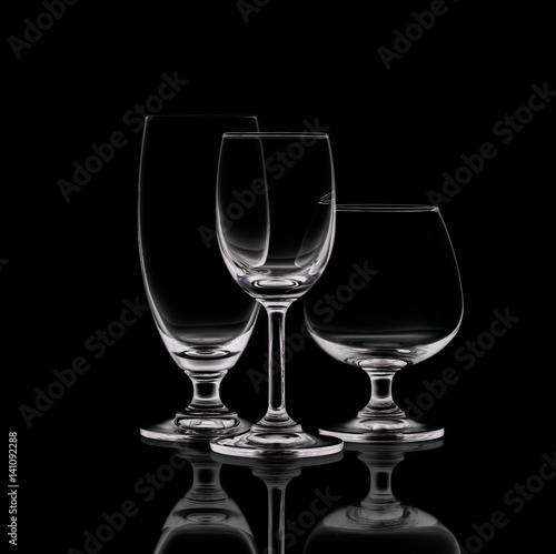 Shot of empty crystal wineglasses on black isolated.