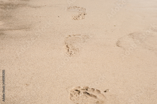 People foot prints on beach sand
