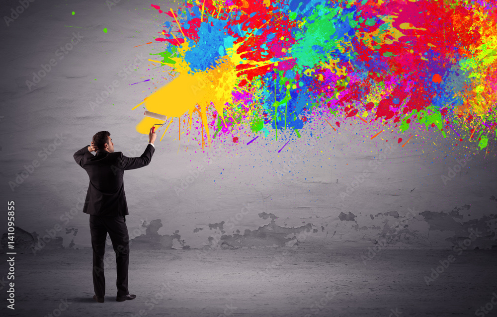Sales person painting colorful splatter Sales person painting colorful splatter