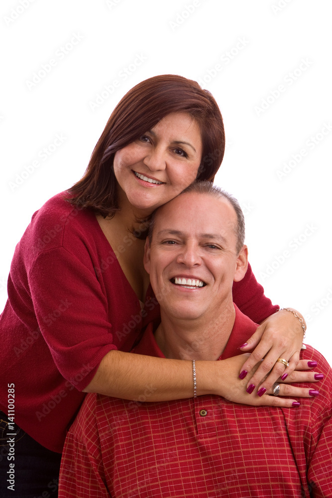 Hispanic couple hugging isolated on white. Hispanic couple hugging isolated on white.