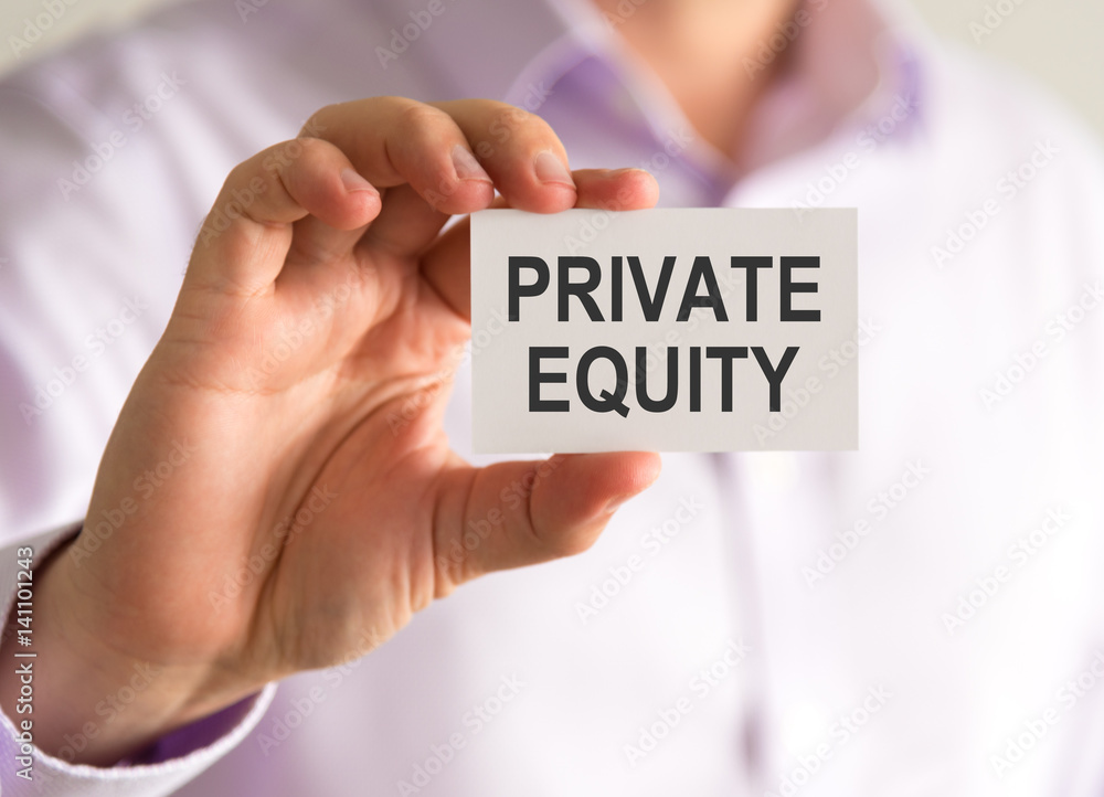 Businessman holding a card with PRIVATE EQUITY message Businessman holding a card with PRIVATE EQUITY message
