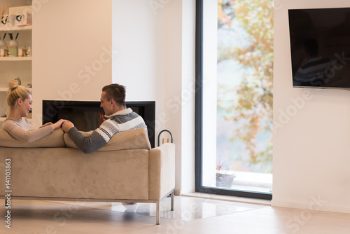 Young couple  in front of fireplace © .shock