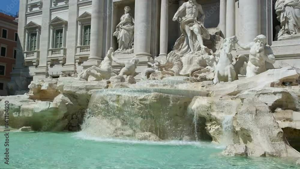 Tourists visiting the Trevi Fountain on a hot sunny day Tourists visiting the Trevi Fountain on a hot sunny day