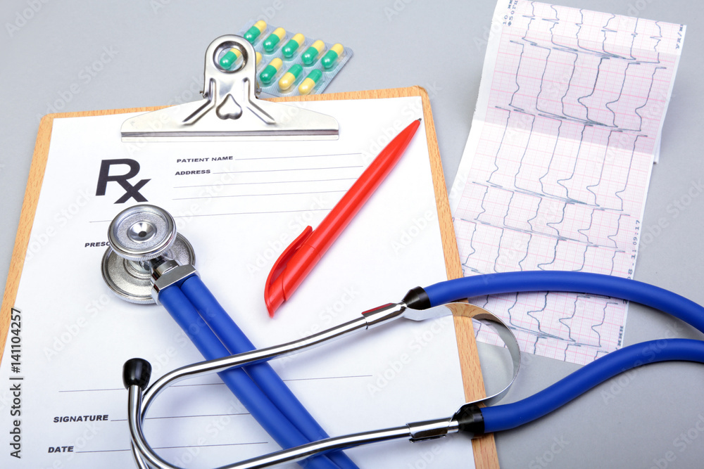 RX prescription, Red heart, asorted pils and a stethoscope on white background RX prescription, Red heart, asorted pils and a stethoscope on white background