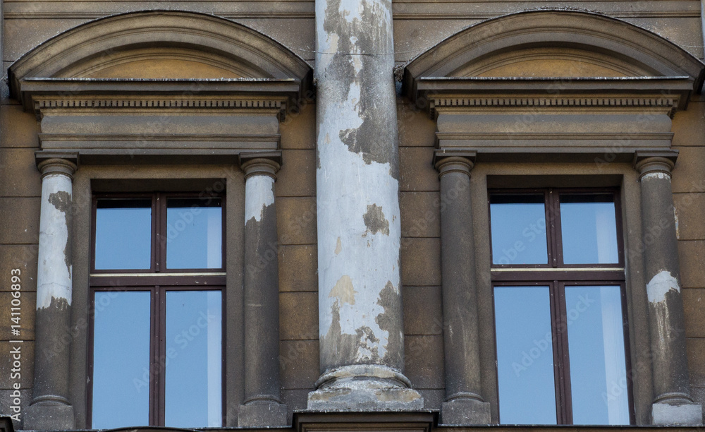 Two vintage front glass windows of an old house