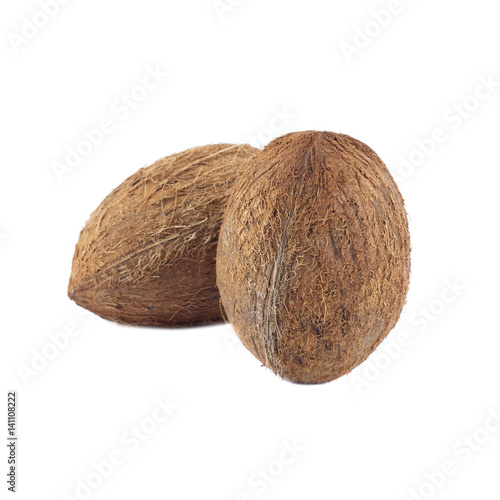 Two whole coconuts isolated on white
