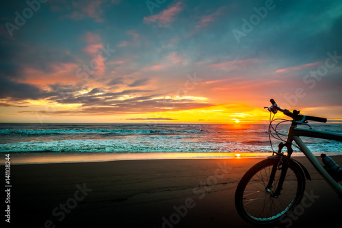 Tourist bike on the coast of the sea at sunset time © k_samurkas