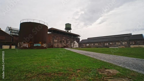 Old factory with a water tower photo