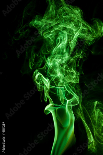 Green smoke movement on black background.