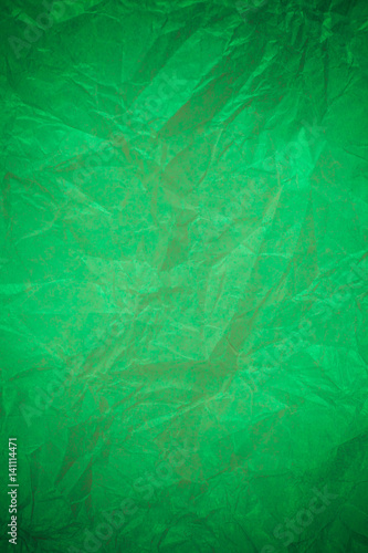 Crumpled green paper recycling background.