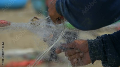 Wallpaper Mural Male hands are twisted the fishing net close-up Torontodigital.ca