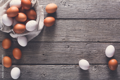 Fresh chicken brown eggs on linen, organic farming background