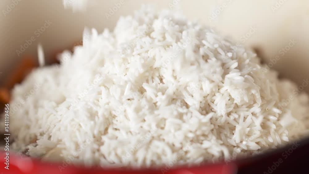Slow motion of adding rice making pilaf, 180fps prores footage Slow motion of adding rice making pilaf, 180fps prores footage