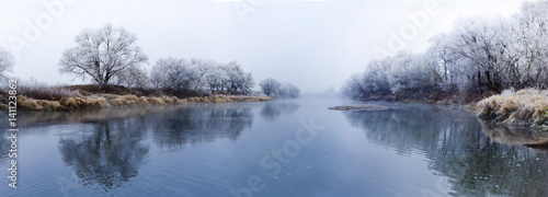 Panoranic view of river at fall misty morning © Denis Krasnoukhov