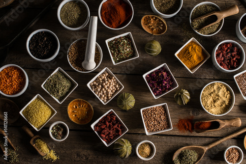 Various of colorful spices on wooden table. place for typography