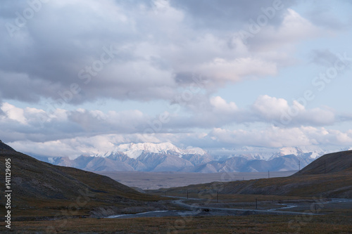 Clouds at sunset. Plateau Kara-Say (3.800 m.) Kyrgyzstan.. photo