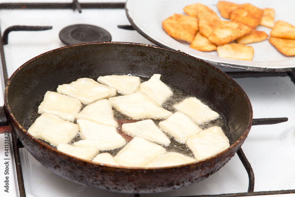 donuts fried in a pan