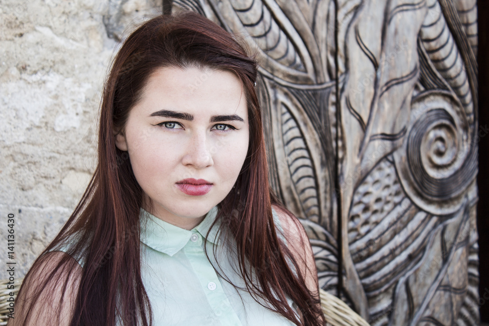 pretty young woman with dark long hair and blue eyes pretty young woman with dark long hair and blue eyes