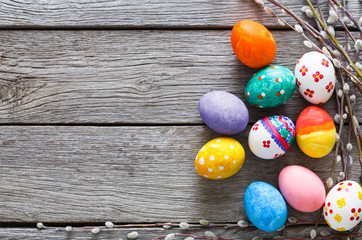 Colorful easter eggs on wood background