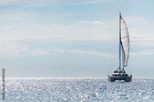 Sailboat yacht on blue sea in summer