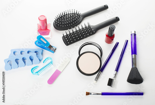 From above shot of cosmetics and skin care objects isolated on white.