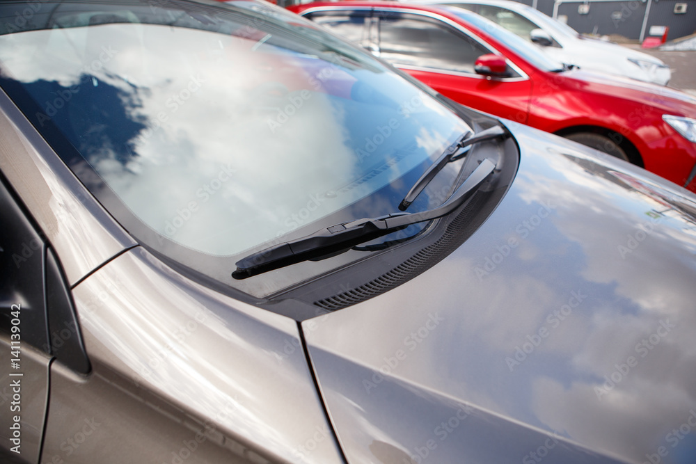 Fototapeta premium Car wipers on the silver brown car