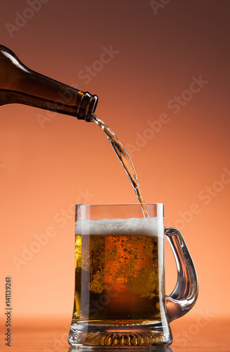 Beer pouring into mug in a bar