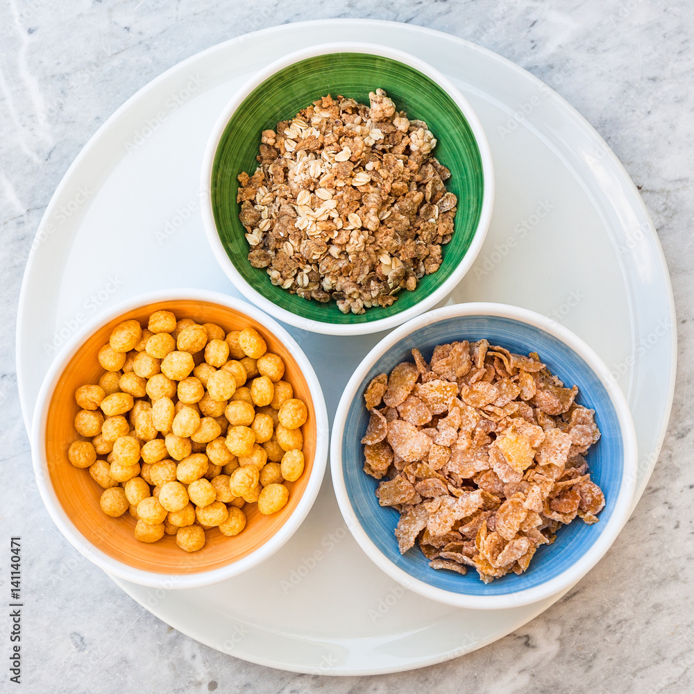 top view of various cold breakfast cereal in bowls top view of various cold breakfast cereal in bowls