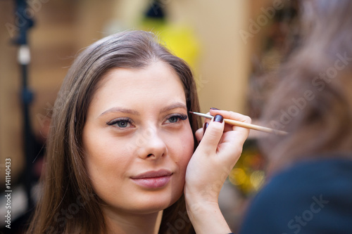 Makeup artist makes beautiful girl makeover