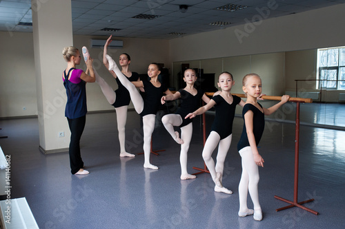 Children engaged in choreography at the ballet school.