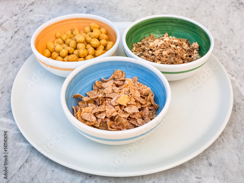 various cold breakfast cereals in bowls