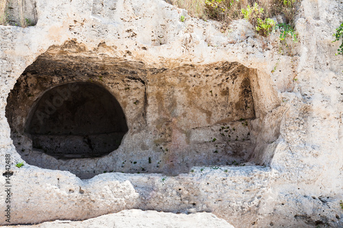 stone room in artificial cave of Greek theater photo