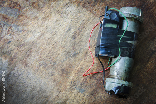 Steel pipe explosive (IED) is ignited by cell phone.For texture and background.