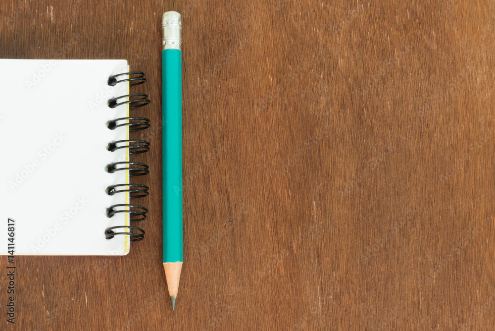 white note book with pencil white note book with pencil