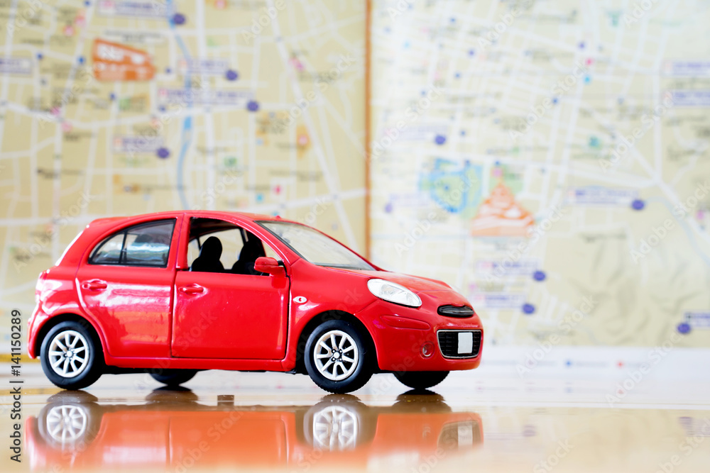 Fototapeta premium Toy red car on vacation