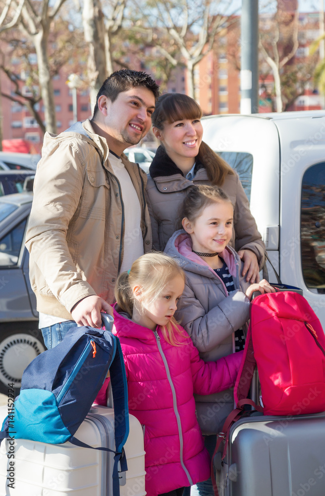 Family with suitcases in journey Family with suitcases in journey